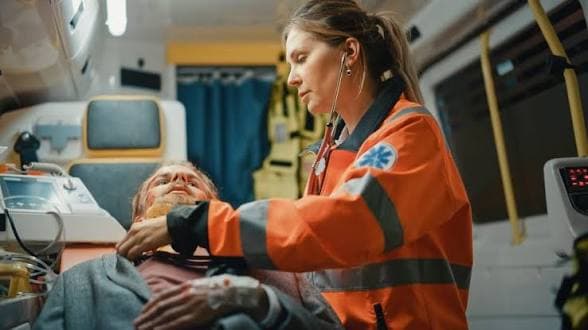 Paramedic providing compassionate patient care